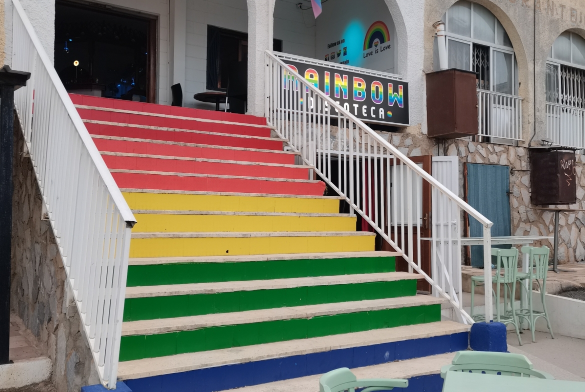 Image of multicoulred steps leading to entrance of the Rainbow bar in La marina